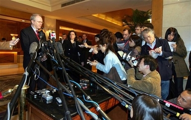 .S. Assistant Secretary of State Christopher Hill, left, speaks to reporters in Beijing, China, Monday, Feb. 12, 2007. 