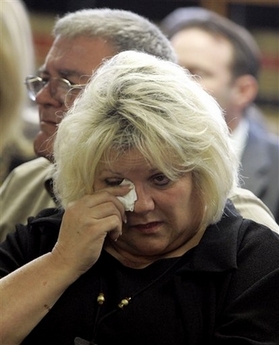 Vergie Arthur, mother of Anna Nicole Smith, wipes a tear as her husband James Arthur, background, looks on in the courtroom at the Broward County Circuit Court in Fort Lauderdale, Fla., Thursday, Feb. 15, 2007. (AP 