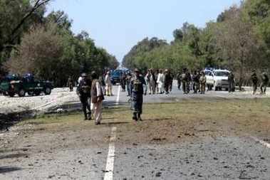 Afghan policemen inspect the site of a suicide bomb attack on a convoy of Western troops in the eastern province of Nangarhar March 23, 2007.