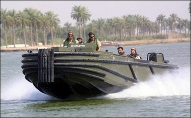 British soliders patrol the waterways close to an oil terminal near the Iraqi city of Basra in 2005. 