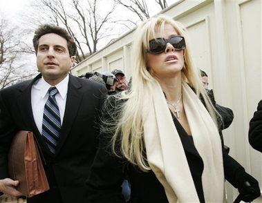 Anna Nicole Smith arrives at the U.S. Supreme Court in Washington with her attorney Howard K. Stern in this Feb. 28, 2006 file photo. 