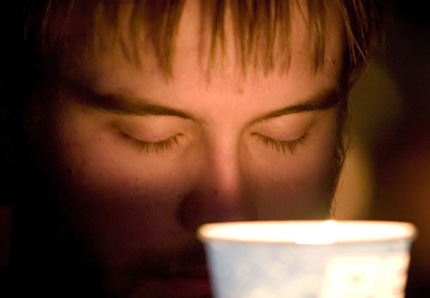 A Virginia Tech student reflects while holding a candle during a vigil the campus of Virginia Tech in Blacksburg, Virginia April 17, 2007. A gunman killed 32 people at a Virginia university on Monday, calmly gunning down students attending class and then killing himself in the deadliest shooting rampage in U.S. history.