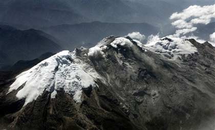 The Nevado del Huila volcano is seen in this aerial view, at the southwestern state of Huila, Colombia, Thursday, in this Feb. 22, 2007, file photo. The volcano erupted twice late Tuesday night and early Wednesday morning prompting evacuations and causing significant damage but no injuries, said authorities. (AP Photo