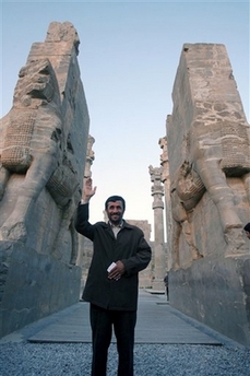 President Mahmoud Ahmadinejad waves as he stands at the 'Nations Gate' of the Persepolis, the ancient Persian capital built by Darius I, during his visit to the Fars province, 540 miles (900 kilometers) south of the capital Tehran,Tuesday, April 17, 2007. (AP