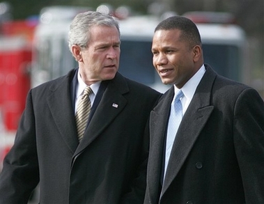 President Bush departs the White House in this Feb. 2, 2005 file photo, with his domestic advisor Claude Allen, right.
