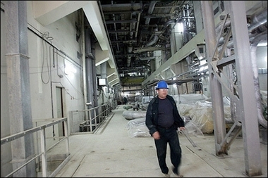 A Russian technician walks inside the Reactor building of the Bushehr nuclear power plant, in southern Iran, February 2006.