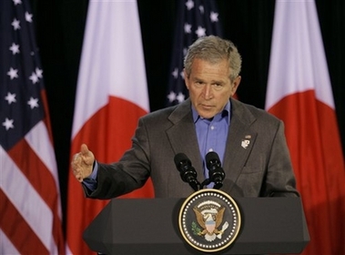Bush gestures during his joint press availability with Japanese Prime Minister Shinzo Abe, not shown, Friday, April 27, 2007 at Camp David, Md., Friday, April 27, 2007. (AP Photo/Gerald Herbert)