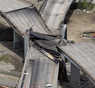 Aerial view of the freeway interchange that funnels traffic off the San Francisco-Oakland Bay Bridge collapsed onto another highway ramp in Oakland, Calif., Sunday, April 29, 2007, after a gasoline tanker truck overturned and caught fire, authorities said. (AP