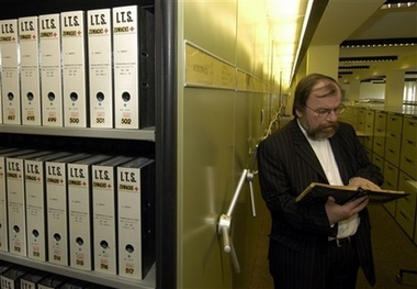 Udo Jost, archive manager, views papers at the International Tracing Service in Bad Arolsen, Germany, April 19, 2006.