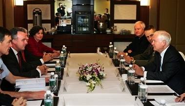 U.S. Secretary of Defense Robert Gates, right, talks with Australian Defense Minister Brendan Nelson, second right, as Chairman of the Joint Chief of Staff Gen. Peter Pace, second right, looks on at the start of their bilateral meeting during the 6th IISS Asian Security Summit in Singapore, Sunday, June 3, 2007. (AP