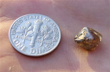 In this photo released by the Arkansas State Parks Department, a tea-colored, 2.93-carat diamond found Tuesday, June 5, 2007, is shown at Crater of Diamonds State Park near Murfreesboro, Ark. 