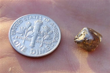 In this photo released by the Arkansas State Parks Department, a tea-colored, 2.93-carat diamond found Tuesday, June 5, 2007, is shown at Crater of Diamonds State Park near Murfreesboro, Ark.
