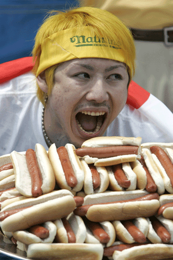 Japanese eater devours 53-plus hotdogs to win eating contest