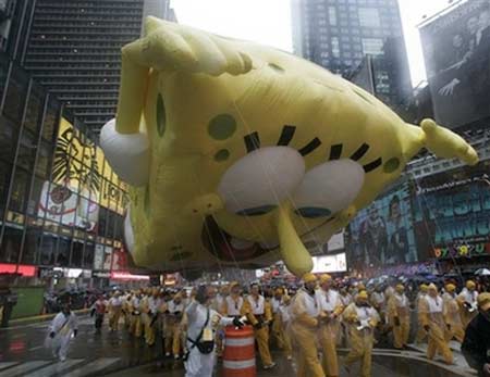 Macy's balloons fly through rain, wind