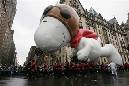 Macy's balloons fly through rain, wind