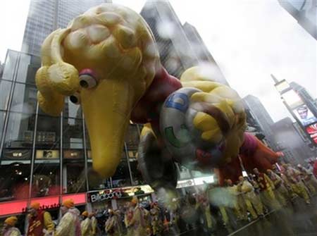 Macy's balloons fly through rain, wind
