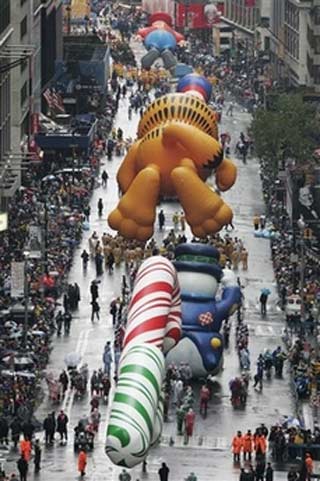 Macy's balloons fly through rain, wind