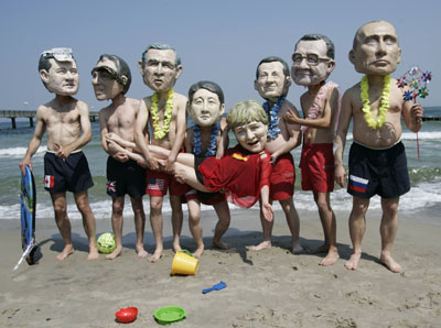 G8 'heads' gather on beach