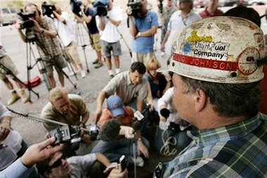 Doug Johnson, director of corporate services for Murray Energy Corp., talks about the six trapped coal miners at the entrance to the Crandall Canyon Mine on Monday, Aug. 6, 2007, northwest of Huntington, Utah. (AP