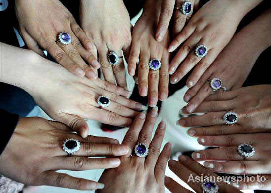 Workers show their copycat wedding rings of Britainâ€™s Prince William ...