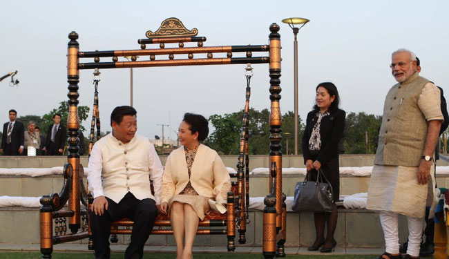 President Xi and wife play swing in Modi's home state