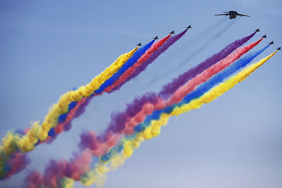 Military aircraft dazzle spectators with stunts