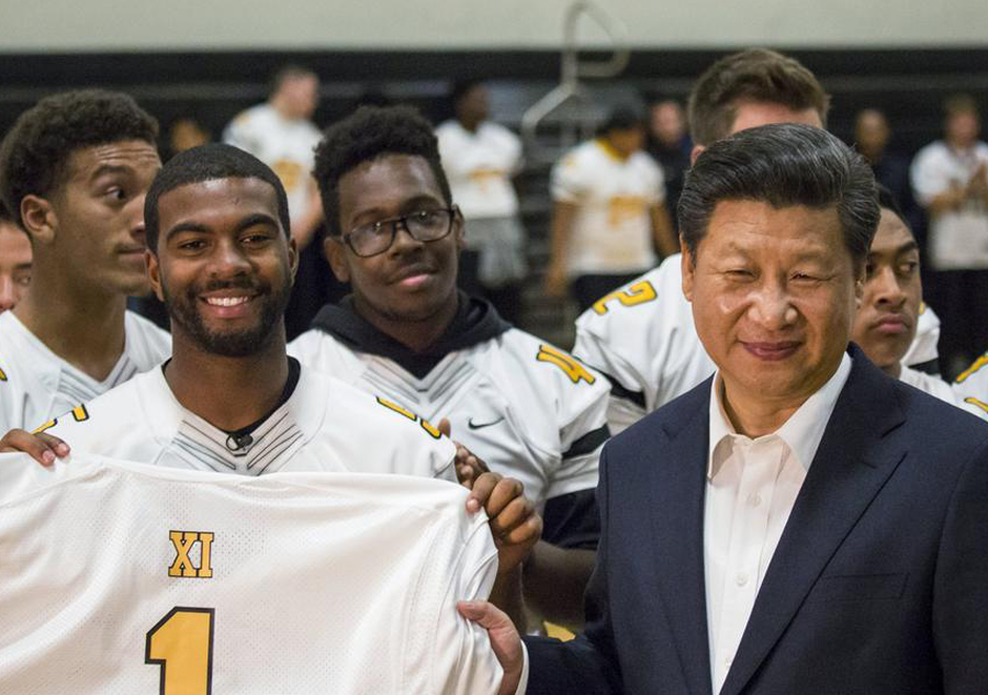 Xi gets high school jersey, invites 100 students to China