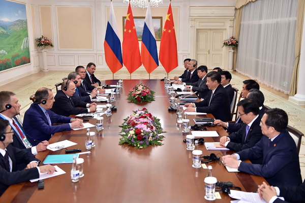 Xi, Putin meet on promoting SCO's regional role