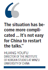 China urges not to 'pour oil on flames'