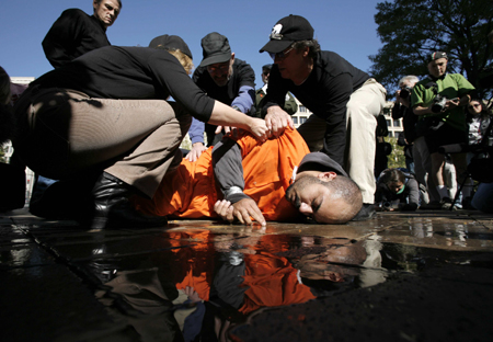 waterboard Protesters take turns waterboarding each other