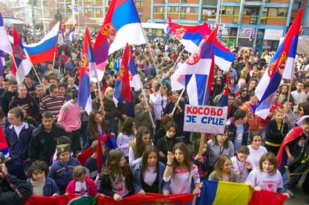 Kosovo Serb residents wave flags during a demonstration in Mitrovica on Feb. 24, 2008 to protest against unilateral declaration of independence by Kosovo authorities on Feb. 17, 2008.