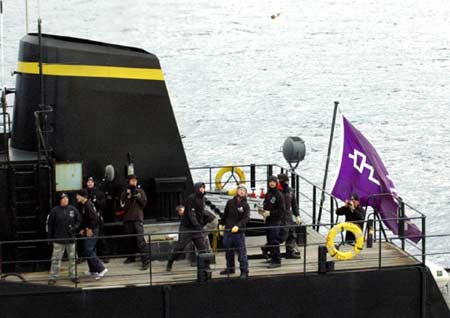 Crew members of the Sea Shepherd ship Steve Irwin hurl bottles towards Japanese research vessel Nisshin Maru in Southern Ocean March 3, 2008 in this handout photo released by The Institute of Cetacean Reserch in Tokyo. 
