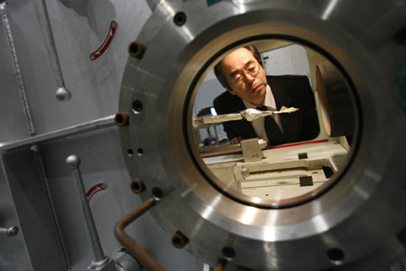 University of Tokyo professor of aerospace engineering Shinji Suzuki examines an origami airplane test model after an experiment in a wind tunnel at a Tokyo University research facility in Kashiwa, Japan near Tokyo, February 6, 2008. 