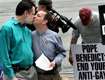 Tom Moulton, left, kisses his husband Brendan Fay, who are from New York City and were legally married in Canada, during a Dignity USA demonstration Saturday, April 12, 2008 in New York, NY. [Agencies]