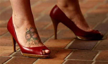 A sex worker sporting a tattoo on her foot participates in a protest in ... A sex worker sporting a tattoo on her foot participates in a protest in ...