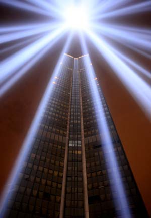 The Montparnasse tower is lit in blue light, as a part of the 7th 