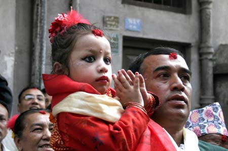 The new Living Goddess Kumari arrives at Kumari Gahar in Kathmandu, Nepal, Oct. 7, 2008. Three-year-old Matina Shakya took her seat as the Living Goddess at Kumari Ghar on Tuesday. (Xinhua/Bimal Gautam)