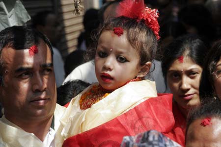 The new Living Goddess Kumari arrives at Kumari Gahar in Kathmandu, Nepal, Oct. 7, 2008. Three-year-old Matina Shakya took her seat as the Living Goddess at Kumari Ghar on Tuesday. (Xinhua/Bimal Gautam) 