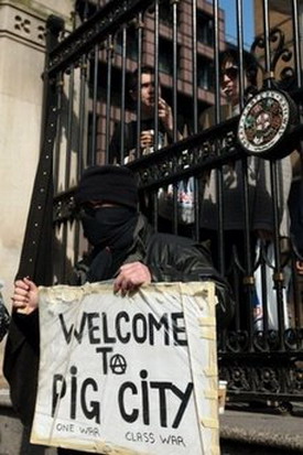 G20 protestors jam downtown London, target banks