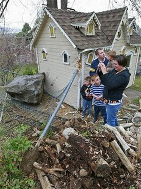 Boulder crashes through hillside home in US