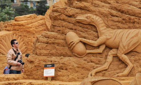 Dinosaur themed sand sculptures in Australia