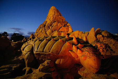 Dinosaur themed sand sculptures in Australia