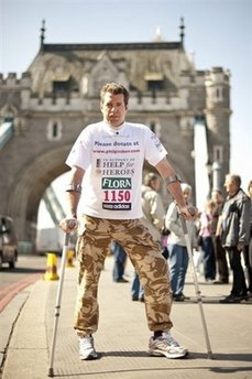 Wounded soldier finishes London Marathon on crutches