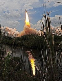 Astronauts inspect Atlantis while chasing Hubble