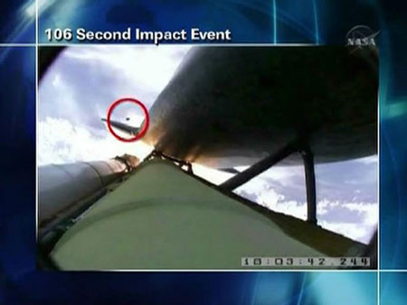 Atlantis inspected for damage while chasing Hubble