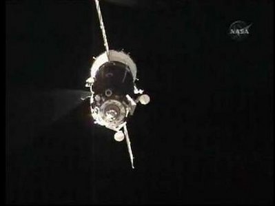 Russian manned spaceship docks with space station