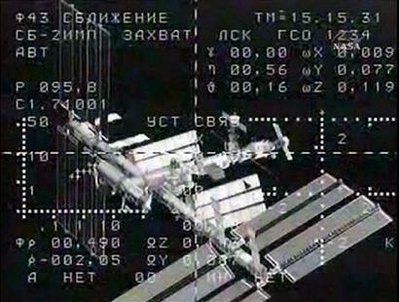 Russian manned spaceship docks with space station