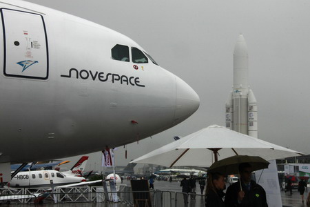Rain glooms Paris Air Show