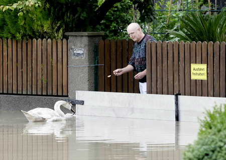8 die in floods, central Europe on alert