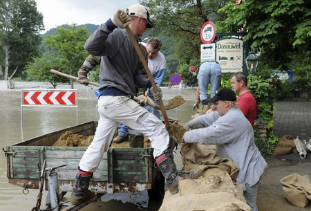 8 die in floods, central Europe on alert